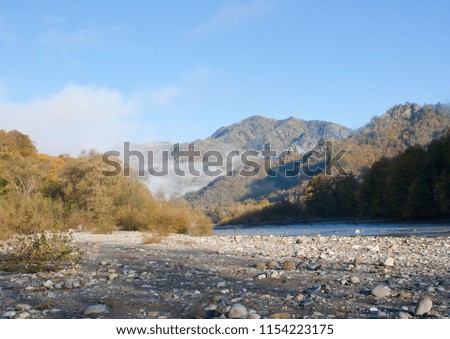 Autumn mountain landscape. Mountain river valley early in the morning