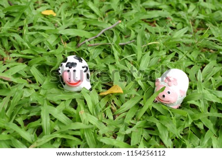 Cow doll on grass.