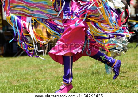 A Native American dancer participates in traditional dances at an annual Pow Wow gathering.