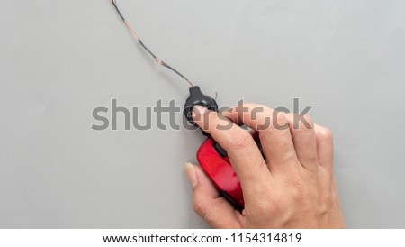 mouse with hand on gray background business concept