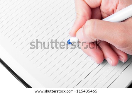 Close up of hand making notes
