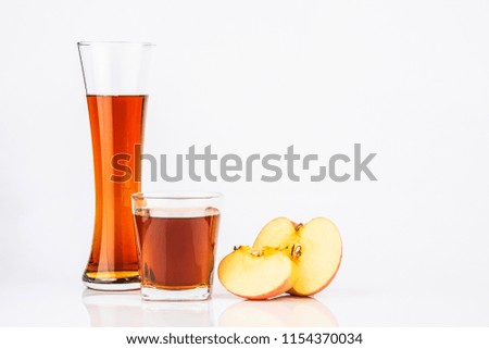 Fresh apple juice from red apples fruits isolated on a white background