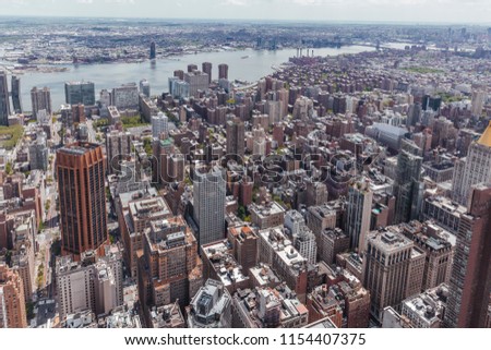 Aerial view of buildings and the East River of Middle Manhattan in New York City, USA