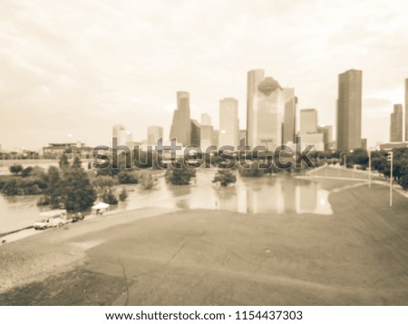 Vintage tone blurred background aerial downtown Houston rare high water flood on Eleanor Park of Tropical Storm. Heavy rains from hurricane disaster caused flooded areas, news truck report and tent