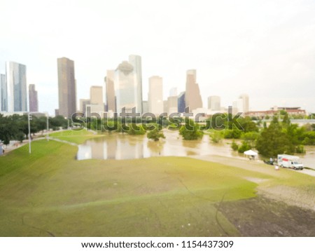 Blurred background aerial downtown Houston rare high water flood on Eleanor Park because of Tropical Storm. Heavy rains from hurricane disaster caused many flooded areas, news truck report and tent