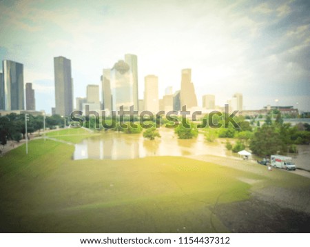 Vintage tone blurred background aerial downtown Houston rare high water flood on Eleanor Park of Tropical Storm. Heavy rains from hurricane disaster caused flooded areas, news truck report and tent