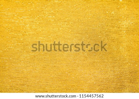 Gold fabric background Royalty-Free Stock Photo #1154457562