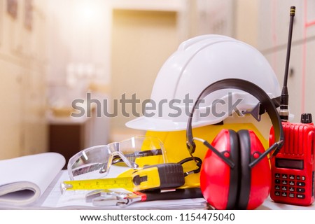 Standard construction safety equipment in control room, Construction and Safety Concept. Royalty-Free Stock Photo #1154475040
