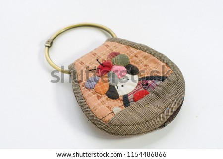 Quilting product. Key ring home pattern of quilt. Homemade Japanese quilt. Japanese handcraft on white background. Signed property release. Selective focus and free space for text,Design idea concept.
