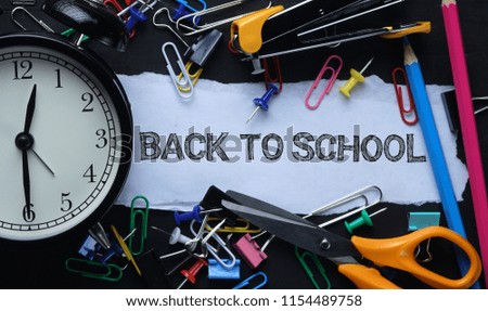 Back To School Tex. Torn Paper and Alarm Clock. School Stationary on Blackboard