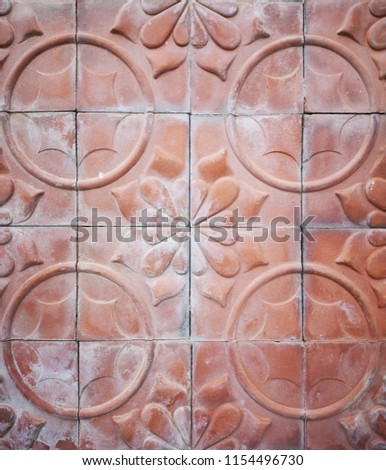 Decorative brick, orange tone colour terracotta tiles wall 