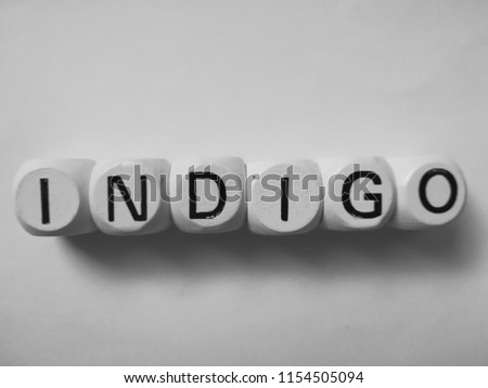 word indigo spelled on dice