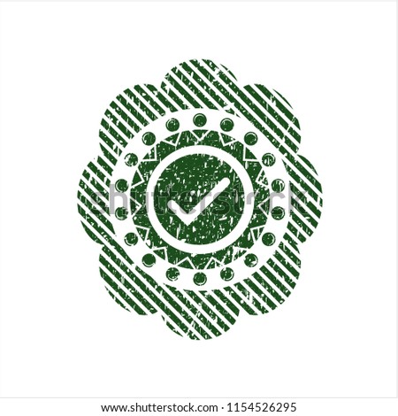 Green tick icon inside distress rubber grunge texture stamp