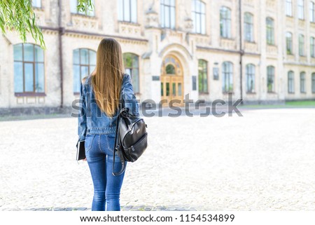 Adulthood life style alone people concept. Rear behind close up view photo portrait of pretty smart clever beautiful student looking at building walking to the entrance wearing fashion clothes