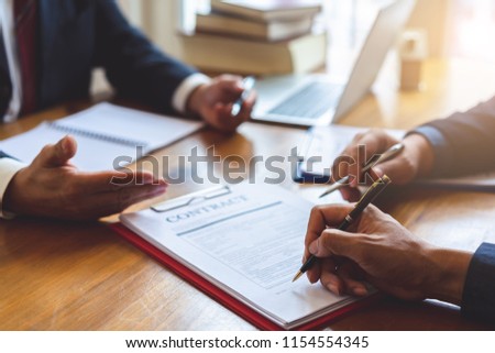 Co-investment business signing agreement after successful deal. Business contract and Meeting and greeting concept.