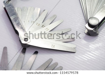 high accuracy feeler gauge for inspection gap of assembly part, tool for check clearance between part, industrial equipment for inspection and quality control Royalty-Free Stock Photo #1154579578