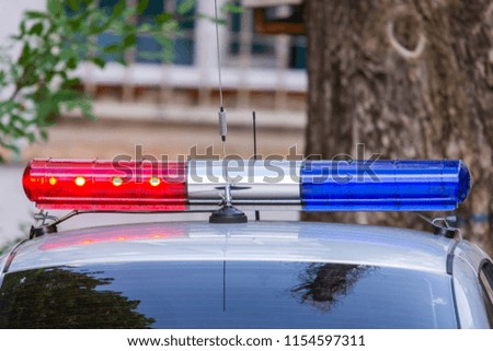Red and blue signal lights on patrol police car or other emergency service