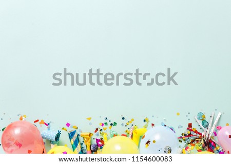 Flat lay decoration party concept on pastel blue background with copy space top view
