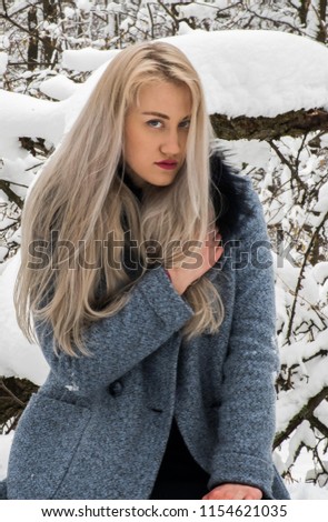 blonde in the winter forest
