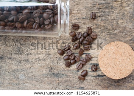 coffee beans in glass bottle.