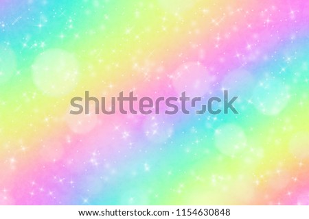 Rainbow background and pastel color. The sweet condy clouds and sky with bokeh and gritter. Cute bright multicolor purple blue green yellow orange pink red magic Abstract backdrop.