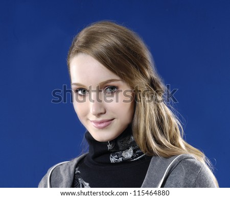 pretty young woman - studio shot on blue background