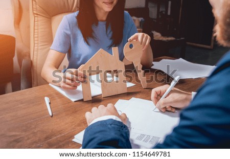 Man sign a home insurance policy on home loans. Estate agent with customer before contract signature. Real Estate concept. Insurance agency concept