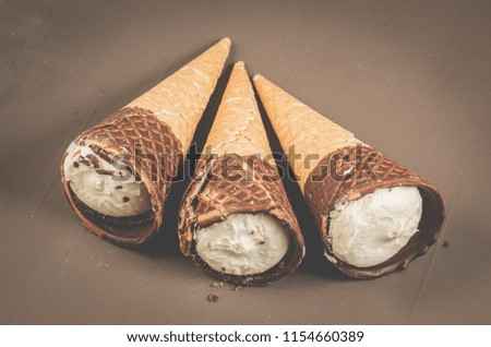 three Ice cream cone with chocolate/three Ice cream cone with chocolate, top view