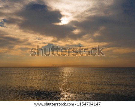 Amazing colours at sunset with light reflecting on the sea 