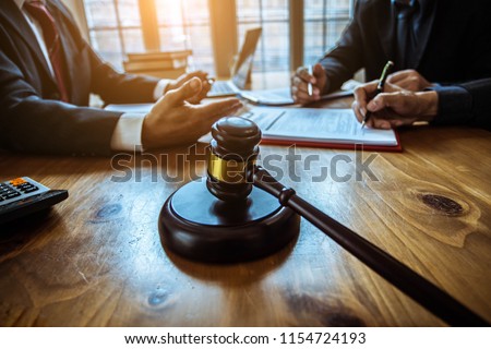 Group of business people and lawyers discussing contract papers ,Consultation between a male lawyer and businessman concept Royalty-Free Stock Photo #1154724193