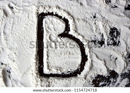 B letter on the flour