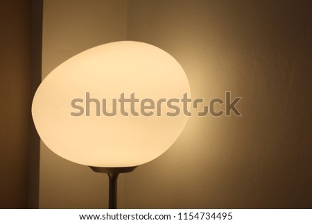 The white lamp is spherical, turn on the light in the white room in the hotel with beautiful lighting.