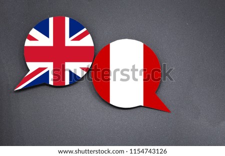 United Kingdom and Peru flags with two speech bubbles on dark gray background