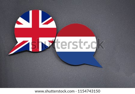 United Kingdom and Netherlands flags with two speech bubbles on dark gray background