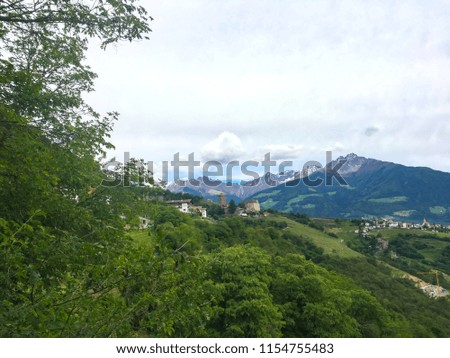 Panoramic view from the hiking trail in Merano on the Italien Alps mountain scenery on a cloudy day in South Tyrol, Italy 