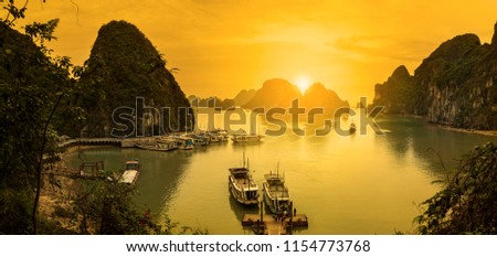 From the Surprise Cave road to the bay. Vietnam sightseeing boats and sunsets.Halong Bay Vietnam. Unesco World Most popular place.