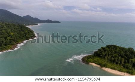 Aerial View of Koh Chang, Thailand with amazing beach, green trees and blue water. Drone picture of tropical island, perfect for beach holiday.