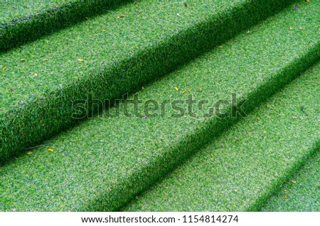 Staircase pave artificial grass and artificial grass has bright green and beautiful.