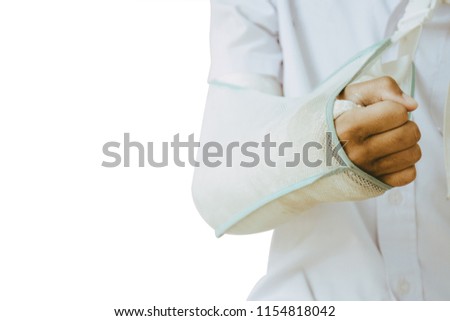 Boy wearing a splint on his arm because of a motorcycle accident. Picture isolated on a white background. Health Concepts.