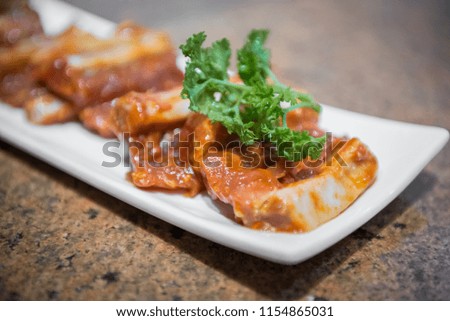 Japanese style pork ribs in white plate