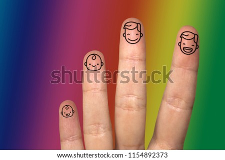 Finger art. Concept of family with different personalities over colored background. Creative conceptual image of finger art. Lgbt flag, adoption concept.