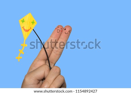 Finger art. Concept of group of people with different personalities over blue background. Creative conceptual image of finger art, kids with kites