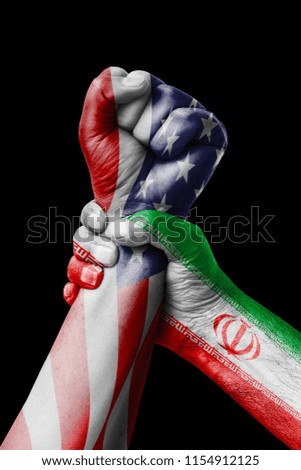 AMERICAN VS Iran, Fist painted in colors of Iran flag, fist flag, country of Iran