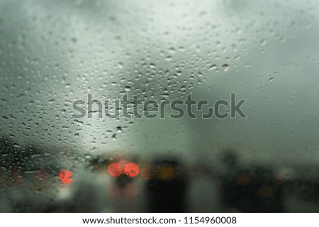 Rain on the motorway, heavy rain on the windshield, windscreen whilst driving on the motorway in a car, van, truck