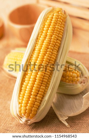 Close up shot Fresh ripe and peeled sweet corn high vitamin nature food on the table