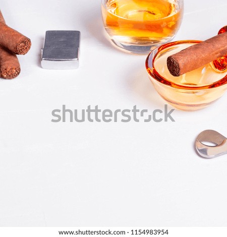 cigar, ashtray, cigarette scissors, lighter whiskey glass white concrete table. Smoke drink Scotch Bourbon wine