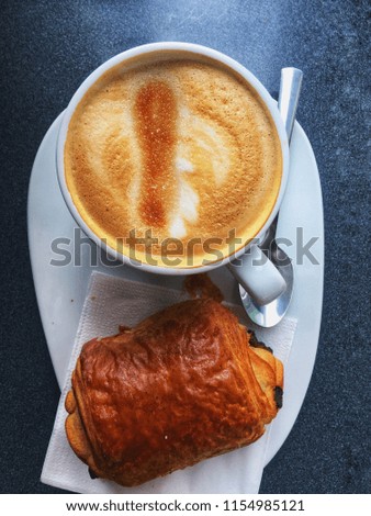 High view of a breakfast, coffee ana croissant, Restaurant interior in the morning