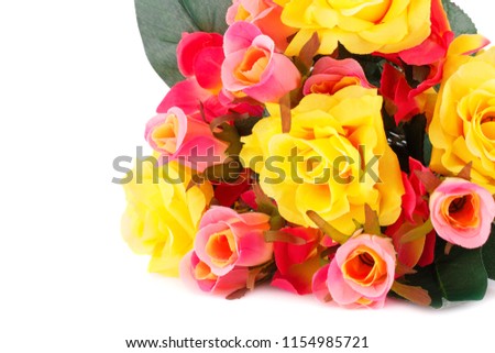 Colorful fabric roses on white background.