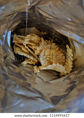Inside of bag packaging with seasoned potato chips