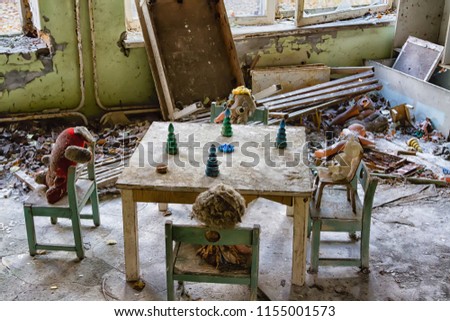 Broken doll in Chernobyl and Pripyat school and kindergarten. Left after nuclear power plant disaster. The exclusion zone, Ukraine Royalty-Free Stock Photo #1155001573